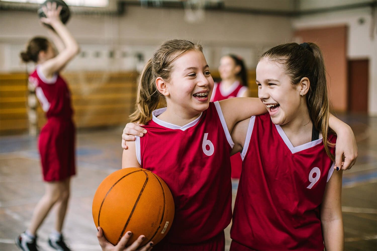 two girls in red top