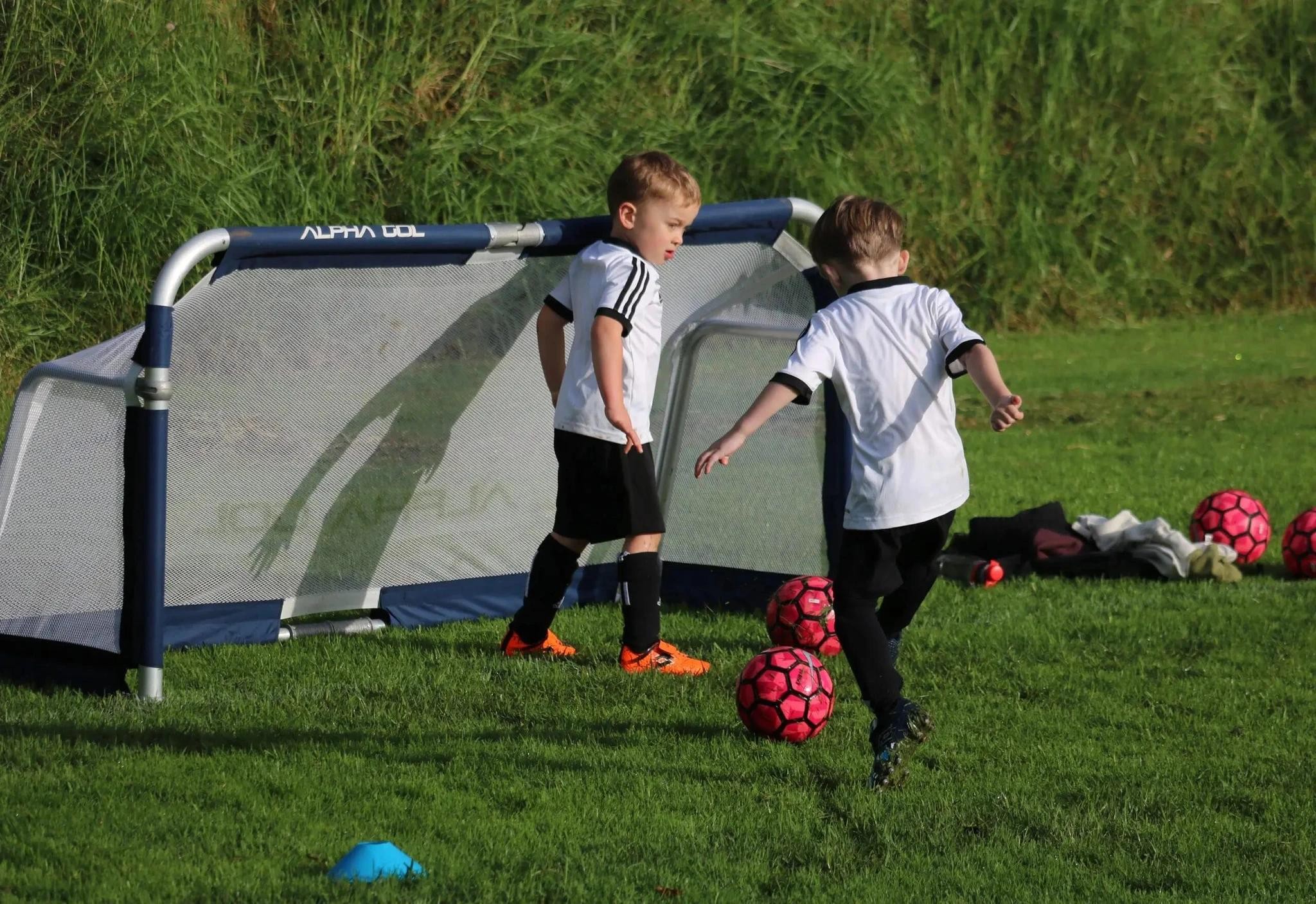 two kids playing football