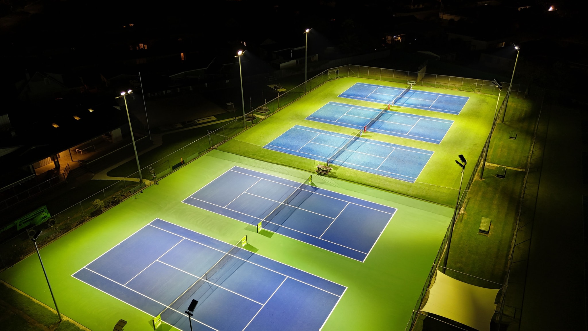 View of floodlit tennis courts